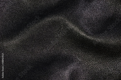 The texture of the leather, the color black. A natural, unique abstract drawing that can be successfully applied to the background of design and creativity.