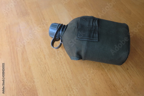 A military flask with a white lid is remembrance of what is left from military training.