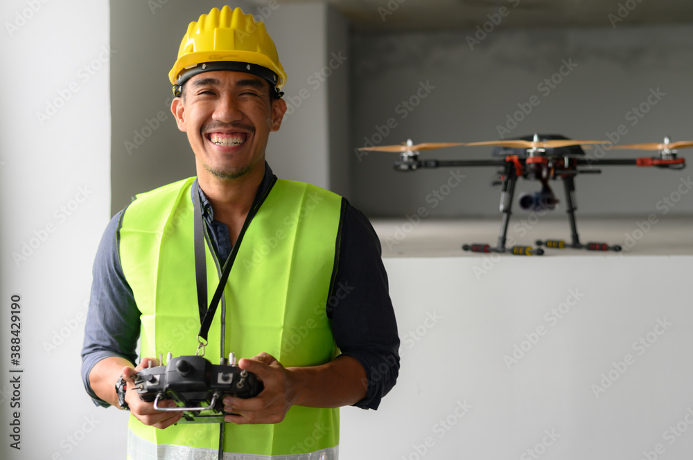 Portrait of construction worker pilot drone at building site. Portrait of construction worker pilot drone at building site.
