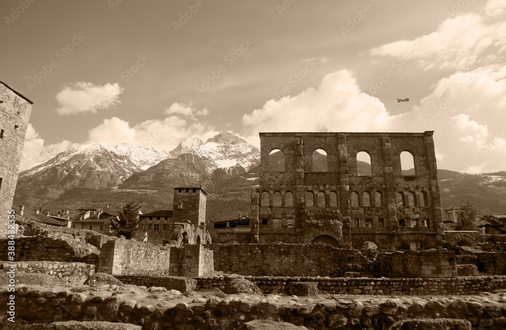 Landscape view of beautiful mountains landscape in valley Aosta. Teatro Romano, Aosta, Italy. Artwork in retro style.