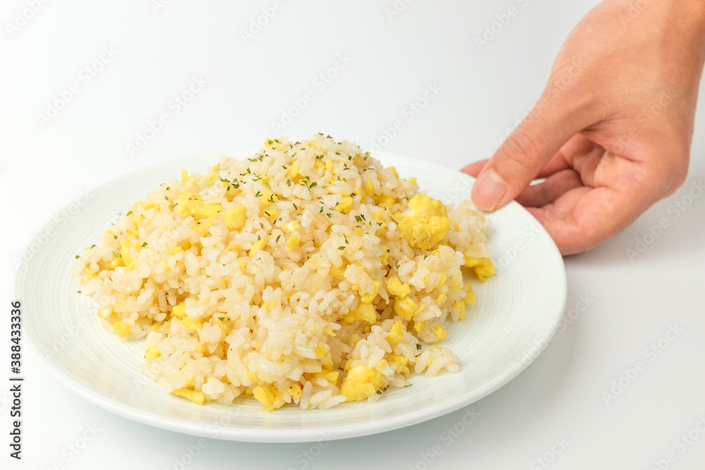 Fried rice with egg on white background Fried rice with egg on white background