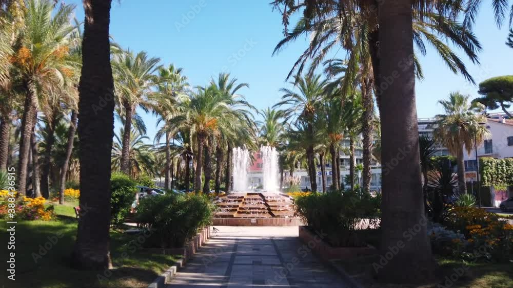Centered shot of fountain in park in summertime Antibes, France Centered shot of fountain in park in summertime Antibes, France