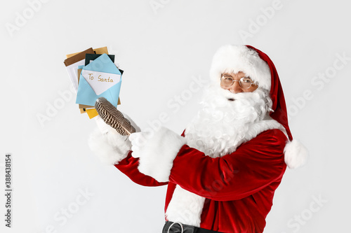 Santa Claus with letters on...