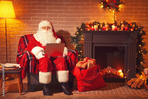 Santa Claus with laptop at ...