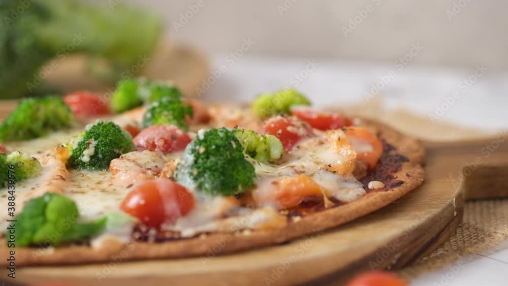 Cheesy Keto Pizza with Tomatoes Broccoli And Salmon for ketogenic diet. set on white cafe table. Cheesy Keto Pizza with Tomatoes Broccoli And Salmon for ketogenic diet. set on white cafe table.