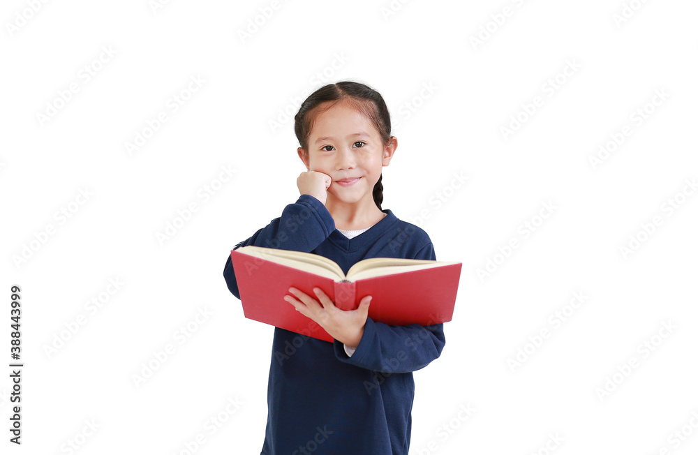 Asian little kid girl in casual school uniform holding open book isolated over white background in studio shot. Education concept Asian little kid girl in casual school uniform holding open book isolated over white background in studio shot. Education concept