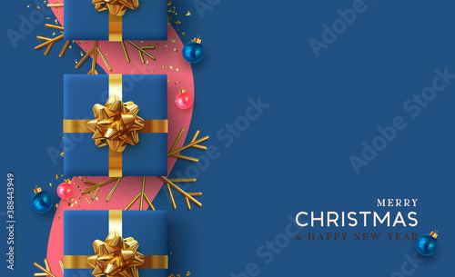 Christmas background. Realistic design with 3d Xmas decoration objects, gift box, bauble ball, gold metal shiny snowflake. glitter confetti. Flatlay top view composition. Greeting card, banner, poster