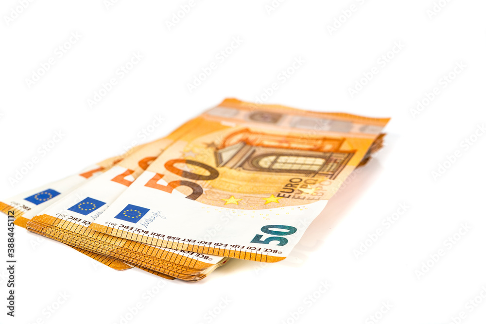 a lot of euro banknotes on white. 50 euros on the table. Money background. Close-up. a lot of euro banknotes on white. 50 euros on the table. Money background. Close-up.