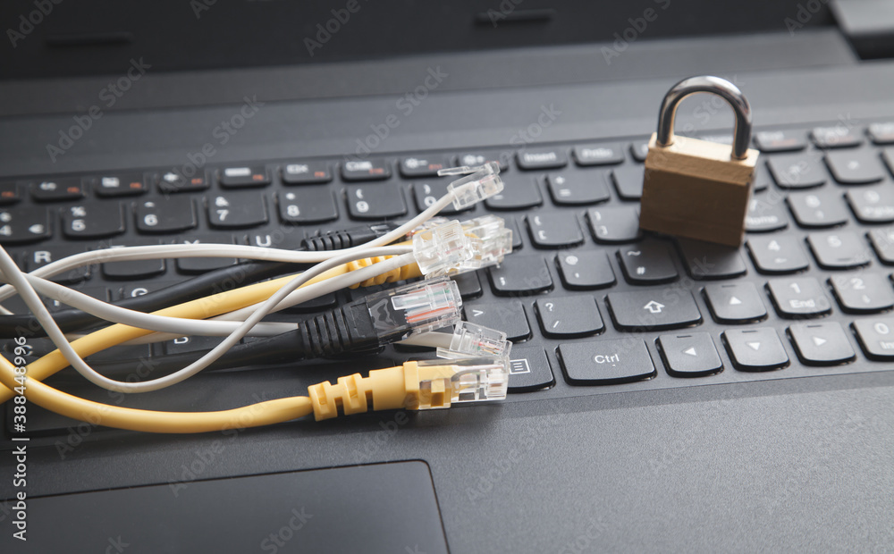 Internet cables with a padlock on the laptop. Internet cables with a padlock on the laptop.