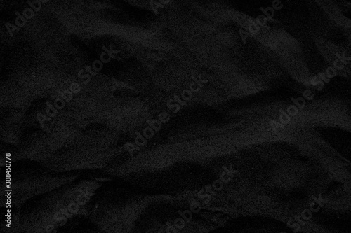 Top view Black sand texture background. Black Friday background concept.