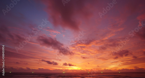 Nature background. Shot of Landscape amazing of red sky sunset in the sea with red clouds background. Travel concept.