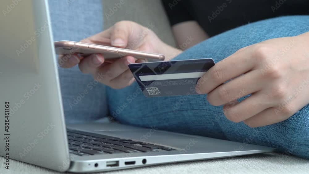 Shopping or paying at home sofa with credit card, smartphone, and laptop. Shopping or paying at home sofa with credit card, smartphone, and laptop.