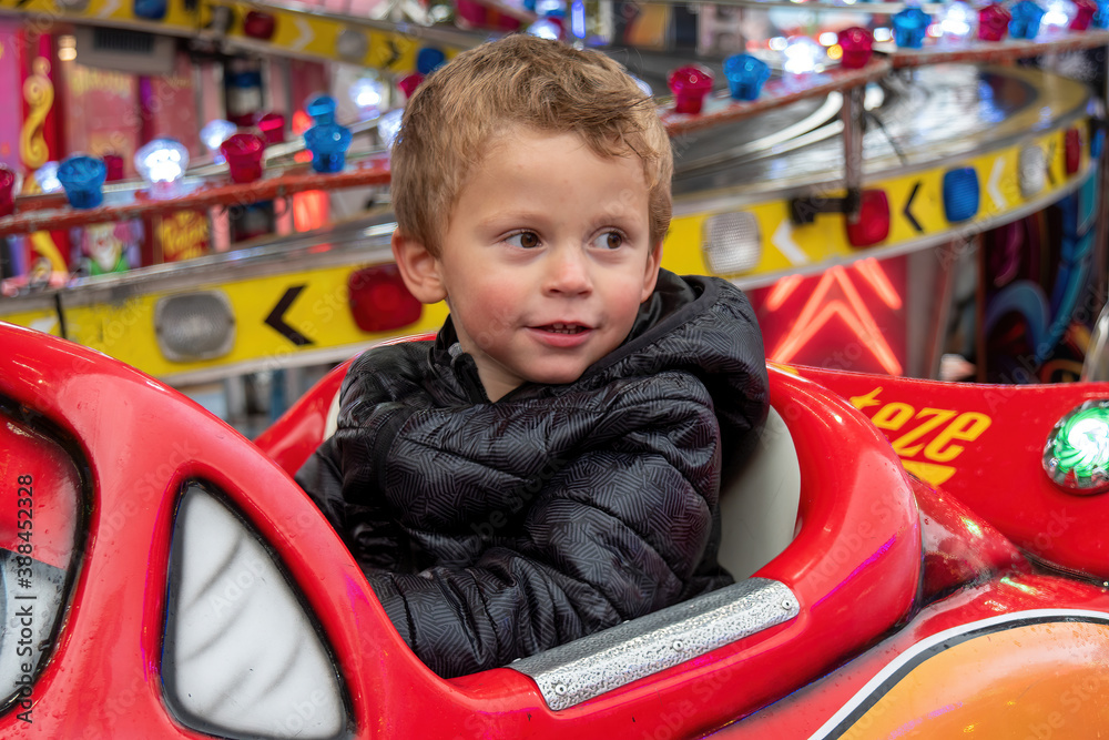 portrait of little boy in a merry-go-round portrait of little boy in a merry-go-round