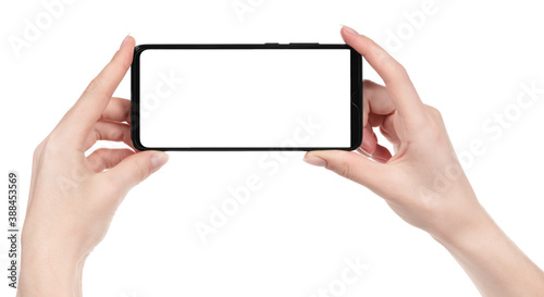 Woman hand holding the black new smartphone with blank screen isolated white background. hands using phone clipping path