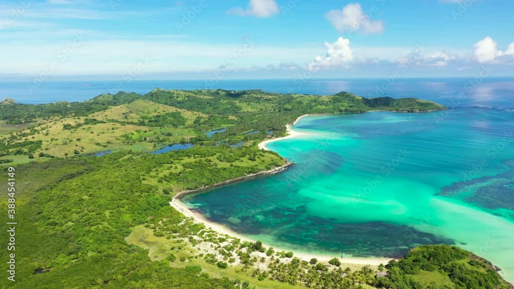 Tropical island with a white beach. Caramoan Islands, Philippines. Beautiful islands, view from above. Warm sea with coral reefs and lagoons. Tropical island with a white beach. Caramoan Islands, Philippines. Beautiful islands, view from above. Warm sea with coral reefs and lagoons.