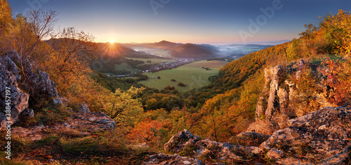 Autumn mountain panorama with golden forest and village in Slovakia