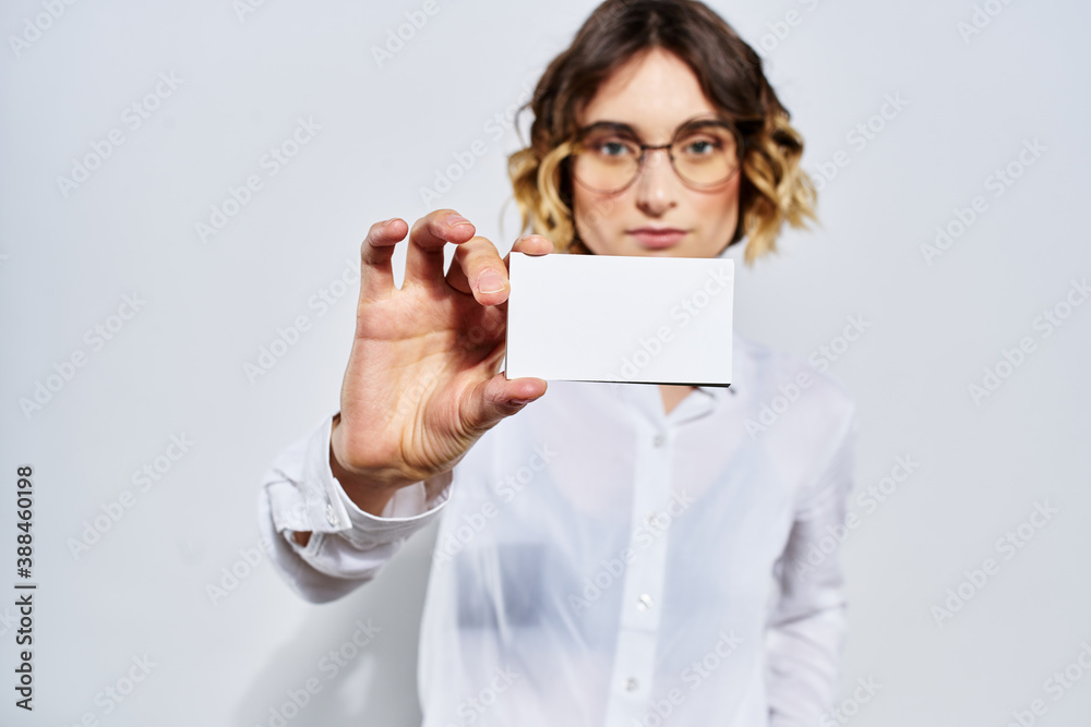 Business woman with card in hand light background credit card mockup Business woman with card in hand light background credit card mockup
