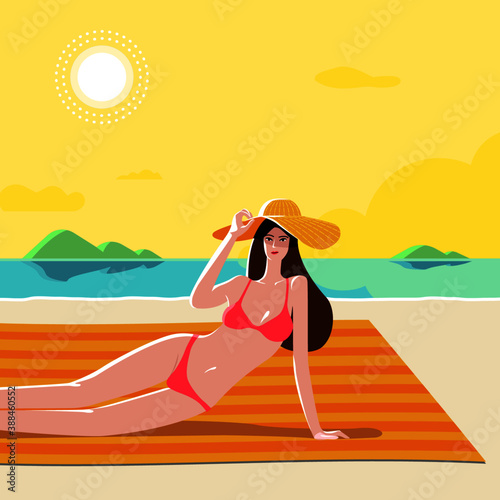 WOMAN IN BIKINI SUNBATHING ON THE BEACH DURING SUMMER VACATION