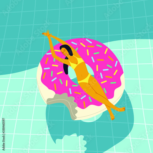 woman laying on the pink donut ring in the pool for sun tanning