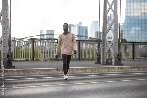 Young Black Man Crossing Street © Nektarstock