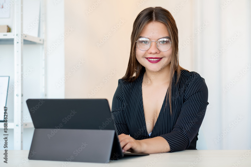 Business coaching. Professional career. Growth self-development. Cheerful successful confident smart woman in glasses working from home office with laptop. Business coaching. Professional career. Growth self-development. Cheerful successful confident smart woman in glasses working from home office with laptop.