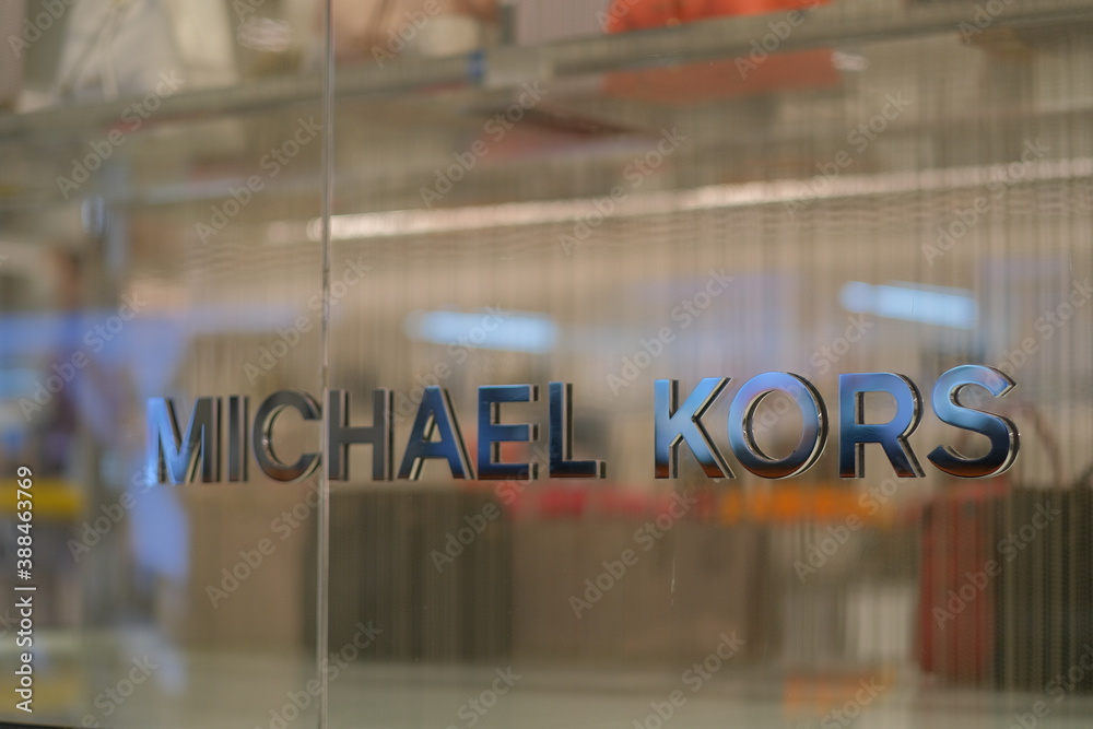 Shanghai/China-May 2020: Close up shiny Michael Kors logo on glass wall  outside store . American luxury brand Stock Photo | Adobe Stock