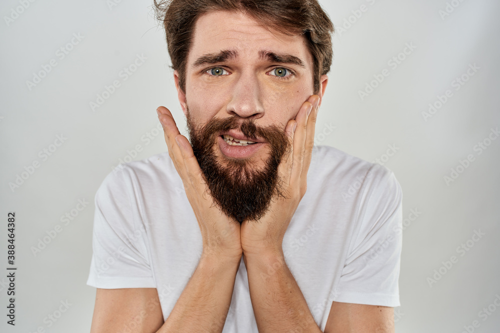 Bearded man gesturing with hand white cropped t-shirt studio lifestyle Bearded man gesturing with hand white cropped t-shirt studio lifestyle