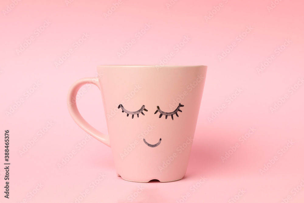 Cup with happy face on pink background Stock Photo | Adobe Stock