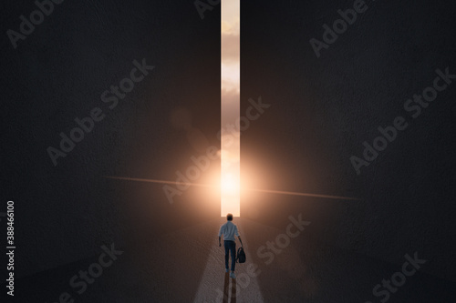 a businessman walking and confront to sunshine