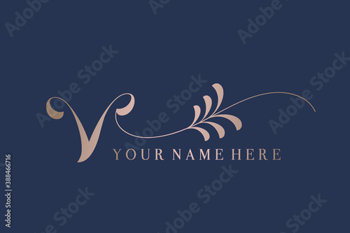 Letter V logo.Typographic icon with calligraphic ornate letter v. Lettering with decorative elements. Luxury alphabet initials. Rose gold sign isolated on dark background. Elegant, wedding style.