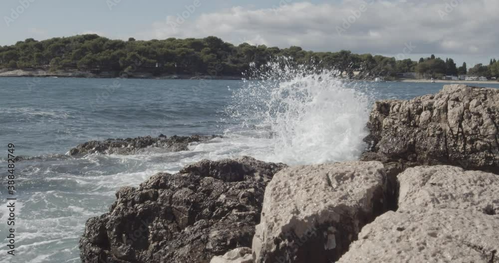 Big Ocean Sea Waves Crashing On Coastal Rocks During beautiful sunny day in summertime. Big Ocean Sea Waves Crashing On Coastal Rocks During beautiful sunny day in summertime.