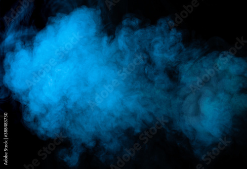 Blue smoke texture on black background