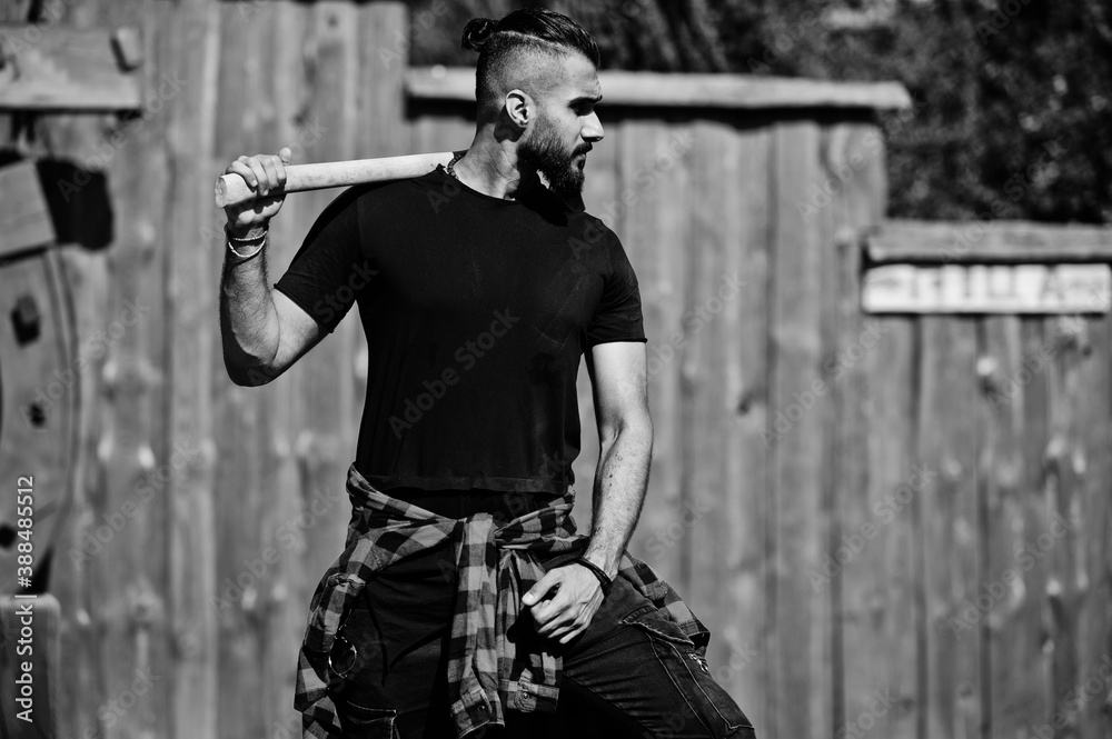 Arab hipster beard man lumberjack hold axe.