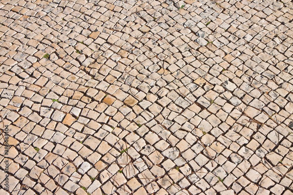Traditional portuguese floor made of small pieces of stone (Portugal - Europe) Traditional portuguese floor made of small pieces of stone (Portugal - Europe)