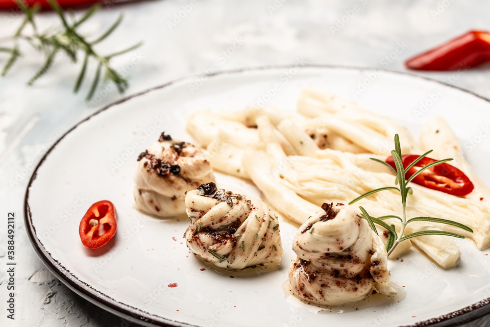 Cheese in marinade with olive oil, chili and rosemary, Food recipe background. Close up Cheese in marinade with olive oil, chili and rosemary, Food recipe background. Close up