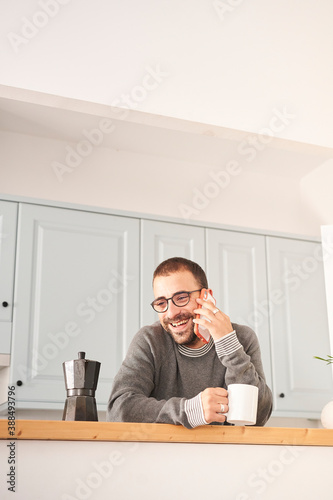 Man at home having coffee.