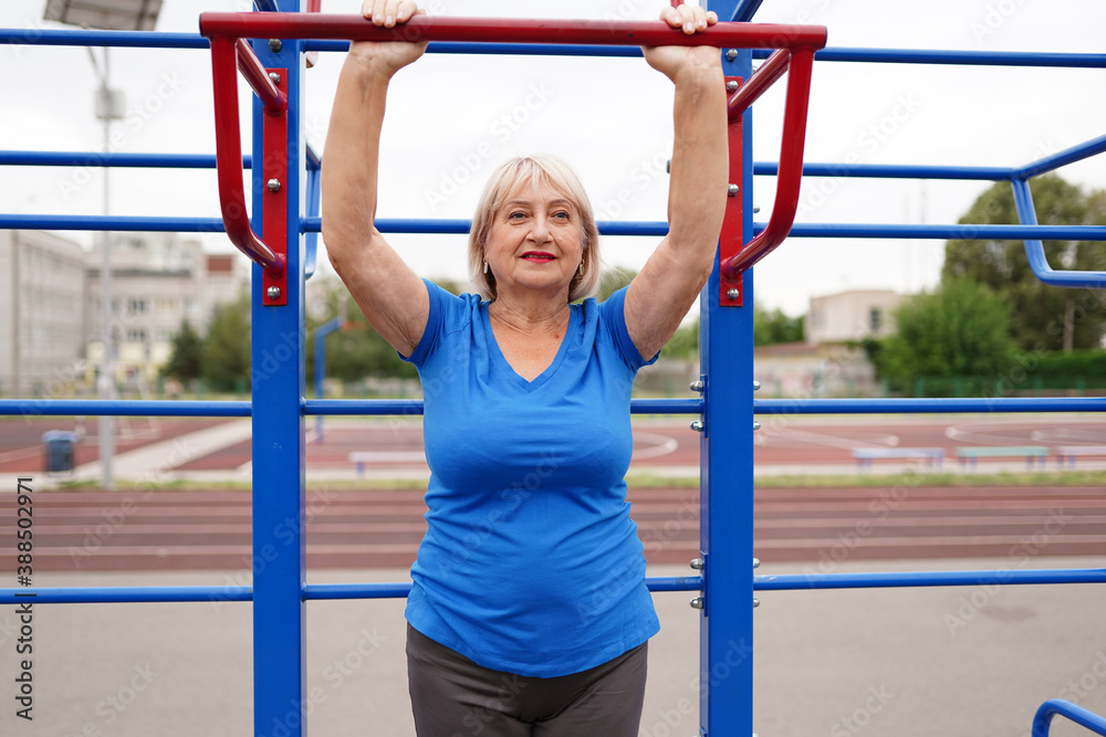 beautiful healthy woman 64 years old doing exercises outdoors beautiful healthy woman 64 years old doing exercises outdoors