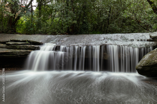 Strong water flow at Terry's Creek waterfall, Sydney after rain.