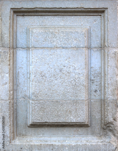 Blank memorial rectangle plaque of a white and gray stone base of a monument with moisture marks- flat surface background framed