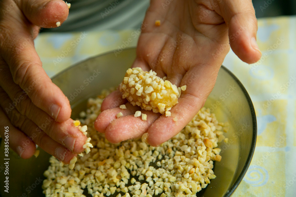 Almond and pine nuts Panellets . Traditional Catalan sweet made with potato, egg, sugar, almonds and pine nuts. Prepares to celebrate Halloween and November 1st