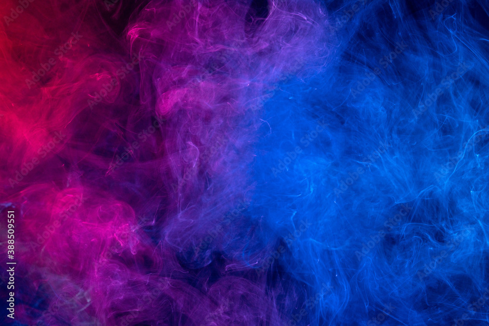 Conceptual image of colorful red and blue color smoke on dark black  background. Stock Photo | Adobe Stock