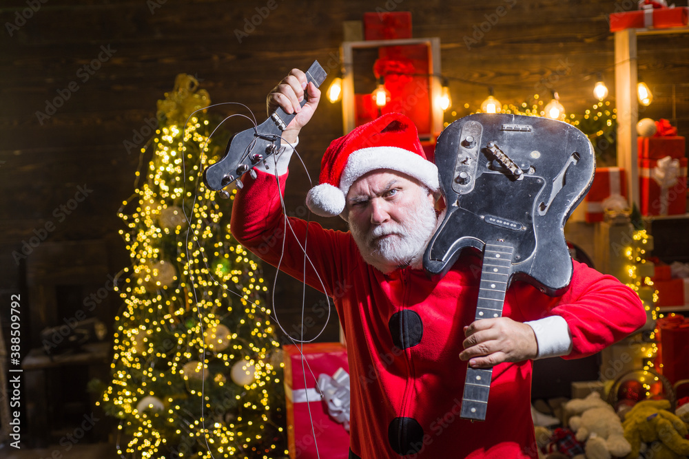 Merry Christmas and happy new year. Santa Claus with broken guitar. Happy  Santa. Christmas time. Christmas. Santa Claus hold electric guitar. Rock.  Electric guitar. foto de Stock | Adobe Stock