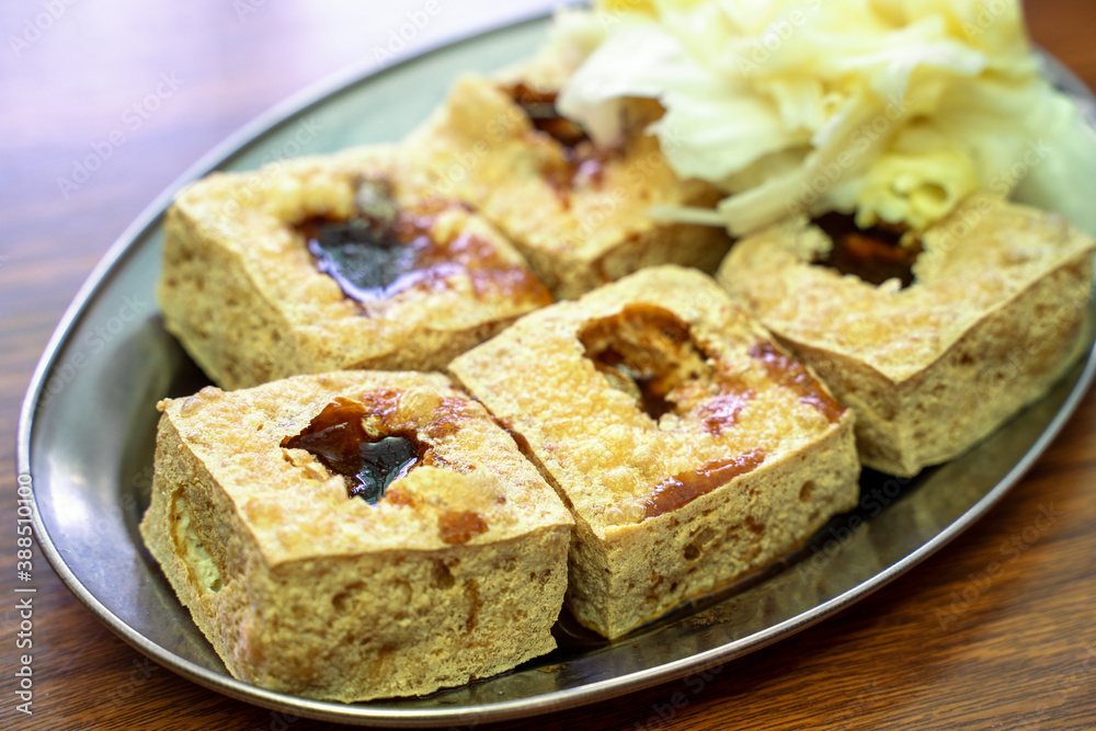 Deep fried stinky tofu with pickled cabbage, famous and delicious street food in Taiwan.