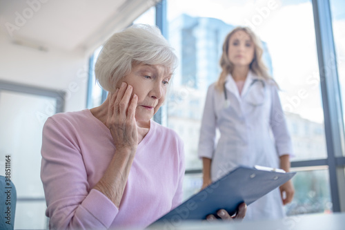 Elderly patient feeling worried after reading the test results