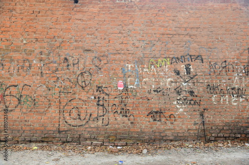 Old brick wall with graffiti