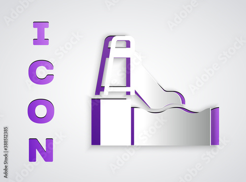 Paper cut Water slide with pool icon isolated on grey background. Aquapark. Paper art style. Vector.