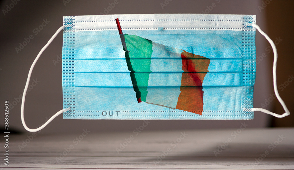 medical and protective mask with the flag of Italy. Concept of coronavirus quarantine. Prevent or stop the spread of the COVID-19 worldwide. medical and protective mask with the flag of Italy. Concept of coronavirus quarantine. Prevent or stop the spread of the COVID-19 worldwide.
