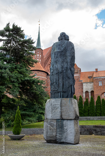 Monument to Nicolaus Copernicus and fragment of a cathedral hill in Frombork. Poland