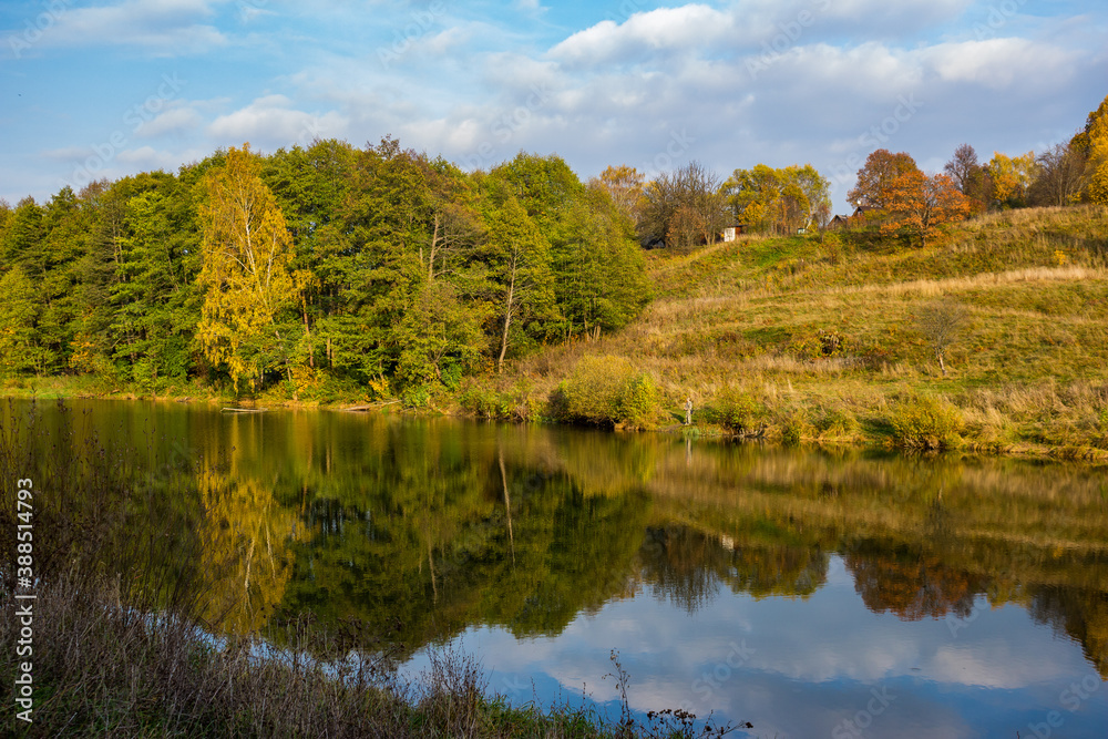 Picturesque autumn landscape with a view of the lake and forest in the background. Rest in the wilderness
Picturesque autumn landscape with a view of the lake and forest in the background. Rest in the wilderness