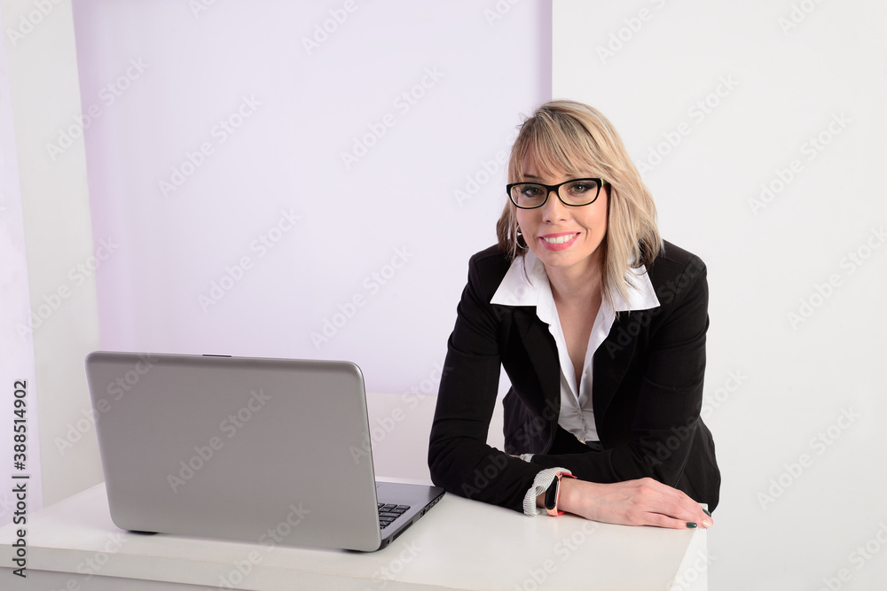 Young business woman at her desk Young business woman at her desk